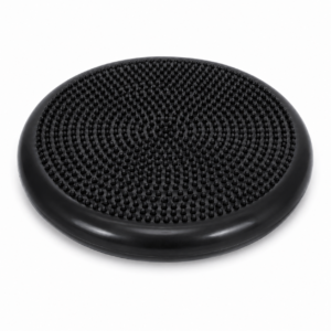 Disque d'équilibre circulaire noir avec une surface texturée cloutée pour l'entraînement à la stabilité